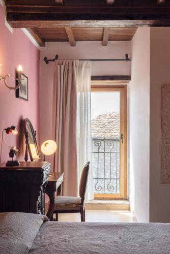 Postel nebo postele na pokoji v ubytování Dimora & Spa Il Cerchio di Lullo