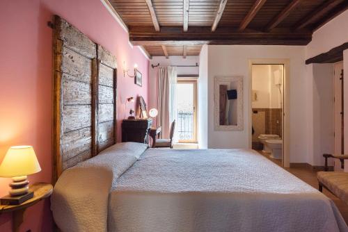 Postel nebo postele na pokoji v ubytování Dimora & Spa Il Cerchio di Lullo