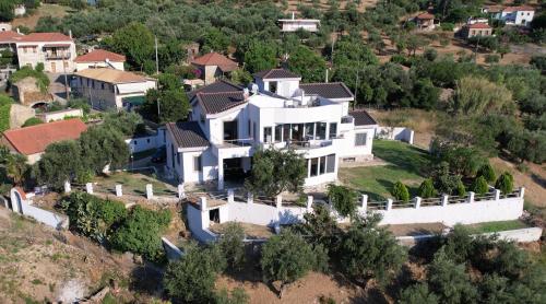 an aerial view of a large white house at Zografos Studios Zacharo Zakharo in Zakharo