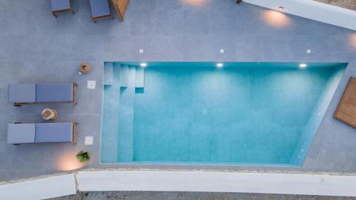 an overhead view of a swimming pool in a house at Velonis Villa with private pool and sea view in Agia Anna Naxos