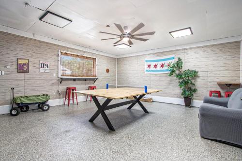 a room with a table and chairs and a ceiling fan at Square Toe's Last Resort in New Buffalo