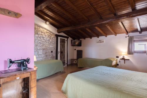 Postel nebo postele na pokoji v ubytování Dimora & Spa Il Cerchio di Lullo
