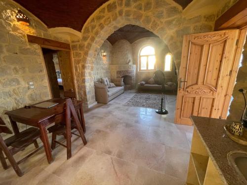 a large living room with a table and a door at Hoopoe lodge in Tunis