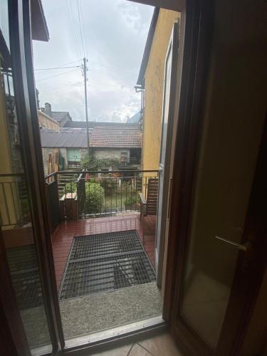 an open door with a view of a balcony at Love Stay BELLINZONA in Bellinzona