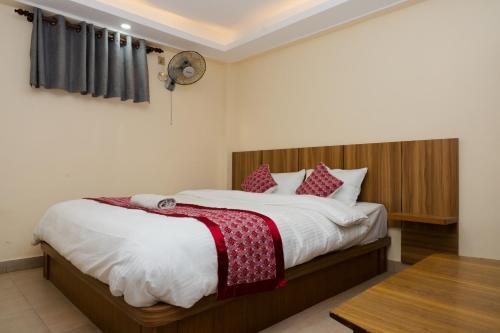 Postel nebo postele na pokoji v ubytování Rightway Hotel & Restaurant