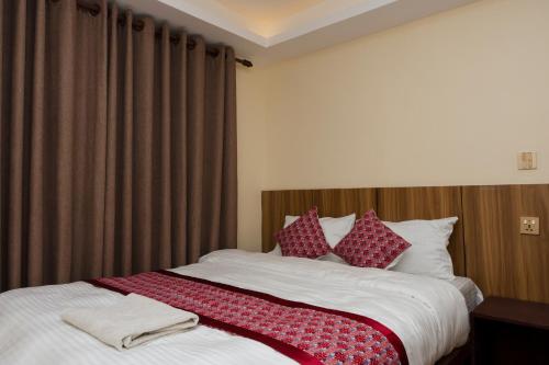 Postel nebo postele na pokoji v ubytování Rightway Hotel & Restaurant
