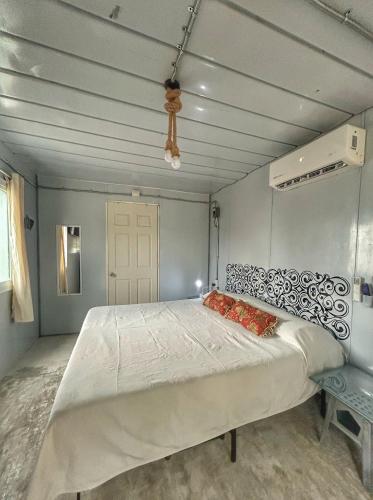 a bedroom with a large bed in a room at Casa Terra cerca de Playa in Barra de Navidad