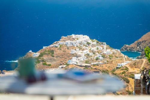 a village on the side of a mountain at Windmill Bella Vista in Artemonas