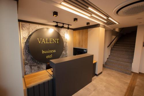 a lobby of a restaurant with a sign that readsvalent business odd at VALENT OTEL BUSINESS in Balıkesir