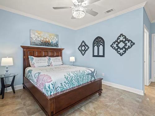 a bedroom with a bed and a ceiling fan at Park Avenue Beauty in Foley