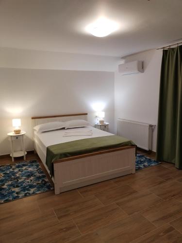 Postel nebo postele na pokoji v ubytování Vila Carla