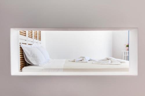 Postel nebo postele na pokoji v ubytování Aegeo Hotel