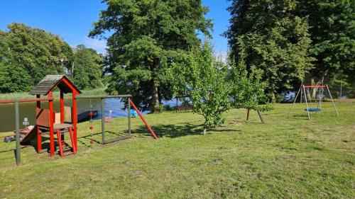a group of playground equipment in a park at Abi in Zalewo