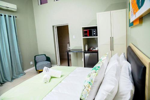 Postel nebo postele na pokoji v ubytování Positano Boutique Hotel