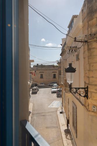 a view of a street from a window of a building at Blue Hues Katerina - House of Character in Qormi