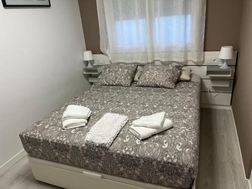 Postel nebo postele na pokoji v ubytování Apartamento con vista lateral, playa Cambrils-Vilafortuny