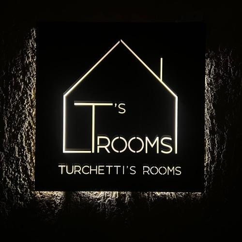 a sign that reads t rooms turtles rooms at Turchetti's Rooms in Porto Ercole