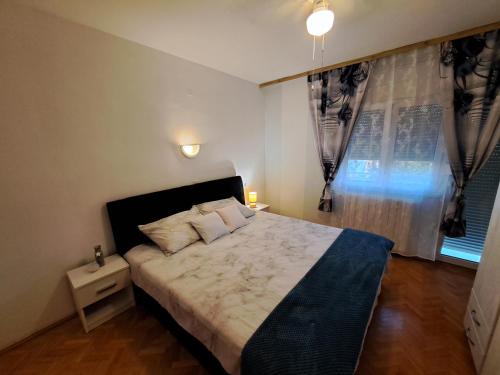 Postel nebo postele na pokoji v ubytování Apartman Martinovic