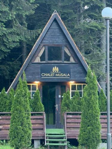 a building with a sign that reads chatel muska at Chalet Musala Borovets by BookVillaBG in Borovets