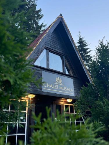 a building with a sign that reads chatel muska at Chalet Musala Borovets by BookVillaBG in Borovets