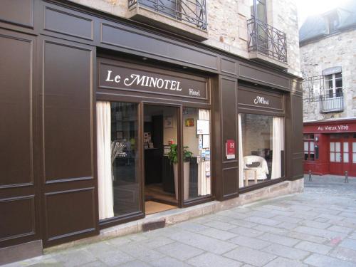 a store front of a store with glass windows at Le Minotel in Vitré