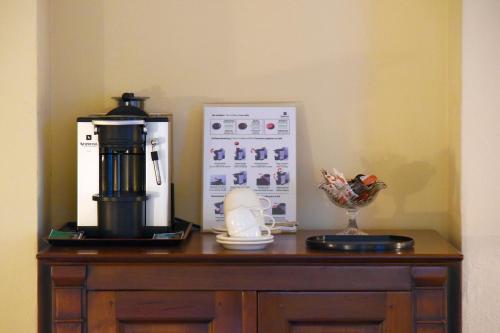 a table with a coffee maker and a blender on it at Unique Hotel Innere Enge in Bern