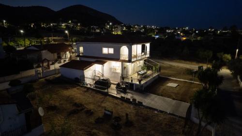 an aerial view of a house at night at Villa Aelia Luxury Maisonette in Salamís