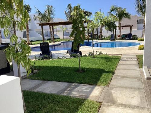 Πισίνα στο ή κοντά στο Almarena Frente al Área Común 4min playa