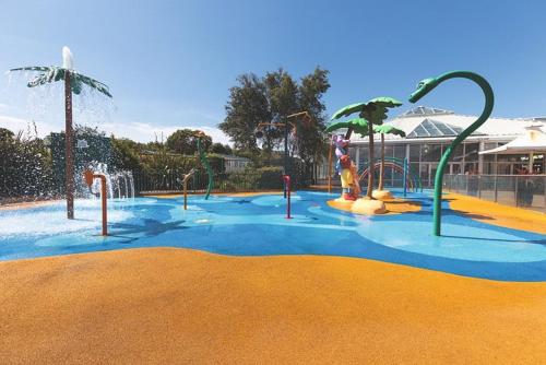 a water park with a playground with slides and a water slide at Haven, Cala Gran caravan park, privately owned in Blackpool