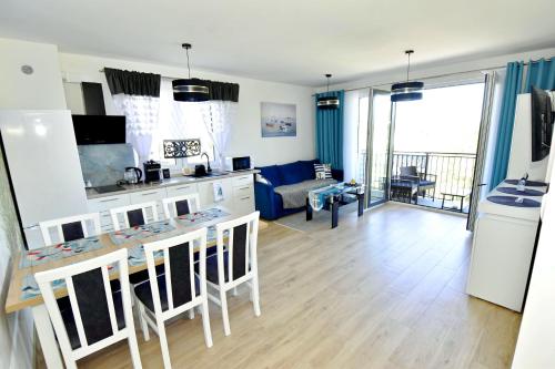 Η κουζίνα ή μικρή κουζίνα στο Apartament Muszelka 28