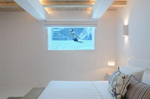 Ένα ή περισσότερα κρεβάτια σε δωμάτιο στο Seabird Sunbird Villas