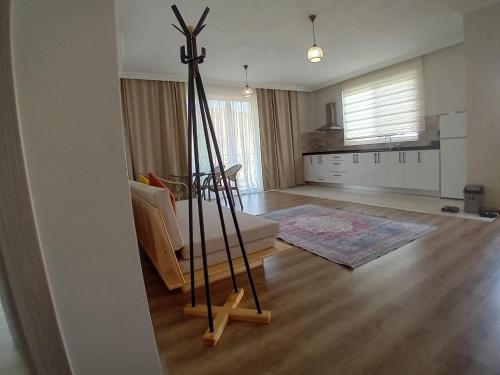 a room with a living room with a living room at GREEN HiLL DEFNE APART in Kas