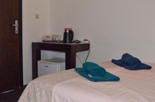 a room with two beds and a table with a table at Villa Dulsinea in Ulcinj