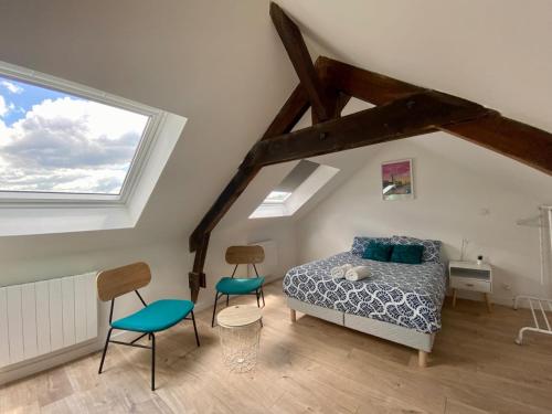 En eller flere senge i et værelse på Kery House Calme et proche du Centre