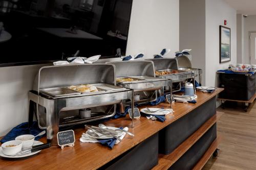 a buffet line with several trays of food at Holiday Inn Resort Oceanfront at Surfside Beach by IHG in Myrtle Beach