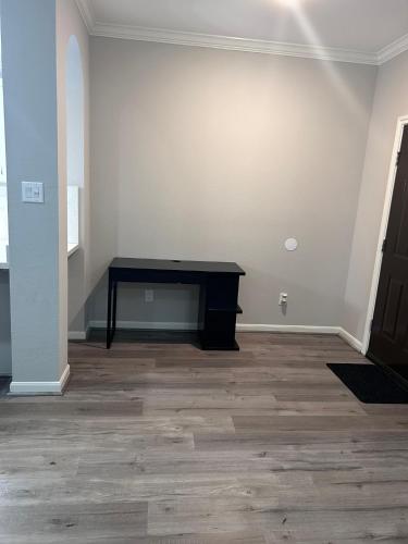 a room with a black table in the corner of a room at Stunning 3BR Home Near Downtown Houston - Sleeps 8 in Houston
