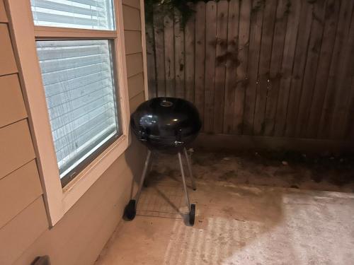 a trash can in a corner next to a window at Stunning 3BR Home Near Downtown Houston - Sleeps 8 in Houston
