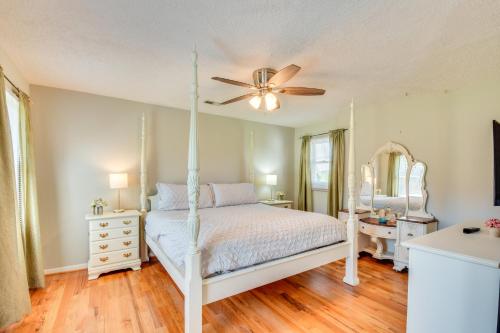 a bedroom with a bed and a ceiling fan at Home with Fire Pit on 27 Acres in Walhalla! in Walhalla