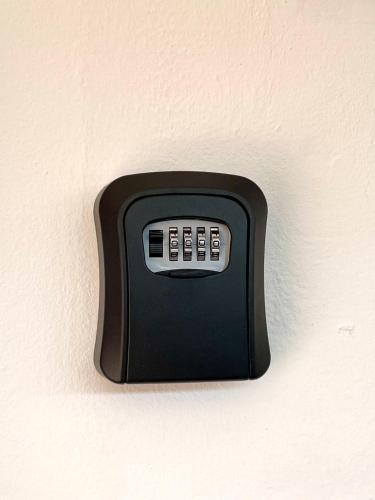 a black remote control attached to a wall at 7 STAY#2 - 1 Room for 3 Pax at Kuala Berang -Best Travelers Stay in Kuala Berang