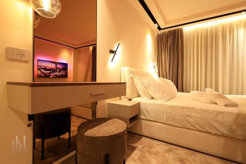 Postel nebo postele na pokoji v ubytování DeHa Rooms & Apartments