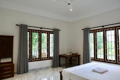 Katil atau katil-katil dalam bilik di Northjoy Resort