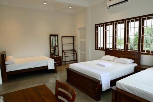 Katil atau katil-katil dalam bilik di Northjoy Resort