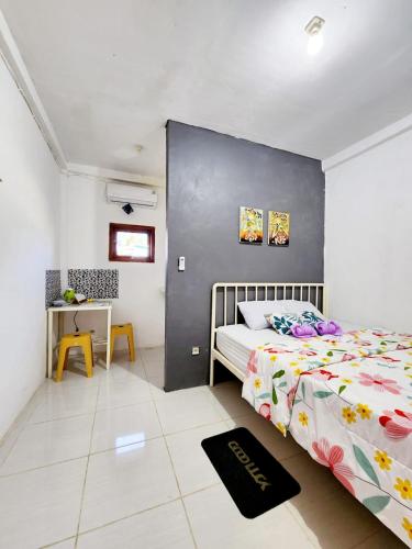 Ένα ή περισσότερα κρεβάτια σε δωμάτιο στο D'Flora Homestay