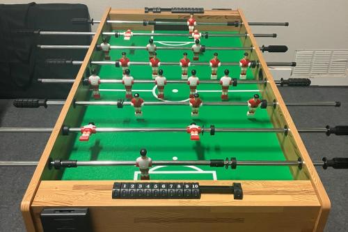 a group of snooker equipments on a green table at Lighthouse Cove in Carrabelle