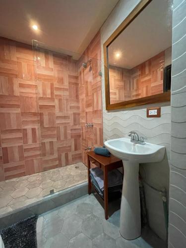 a bathroom with a sink and a shower at Pipas Apartment I Walk to the beach in Tamarindo