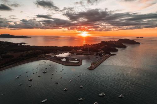 an aerial view of a harbor with boats in the water at Flamingo Marina Cove 404- Oceanfront Condo in Playa Flamingo