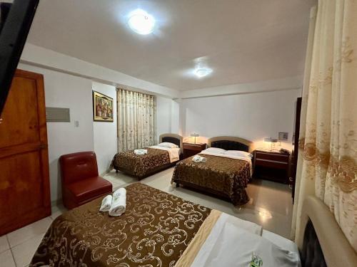 Ένα ή περισσότερα κρεβάτια σε δωμάτιο στο Hotel Residencial Los Tres Pinos