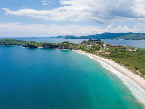 an aerial view of a beach in the ocean at 360 Splendor 104B-Ocean View Condo-Breakfast in Playa Flamingo