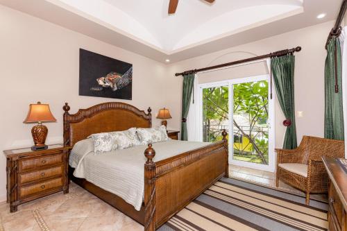 a bedroom with a bed and a window at Matapalo 203- 2 Bedroom Condo At Tamarindo in Tamarindo