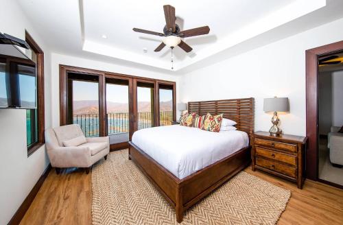 a bedroom with a bed and a ceiling fan at 360 Splendor 105A-Ocean View 2 Br Condo-Breakfast Included! in Playa Flamingo